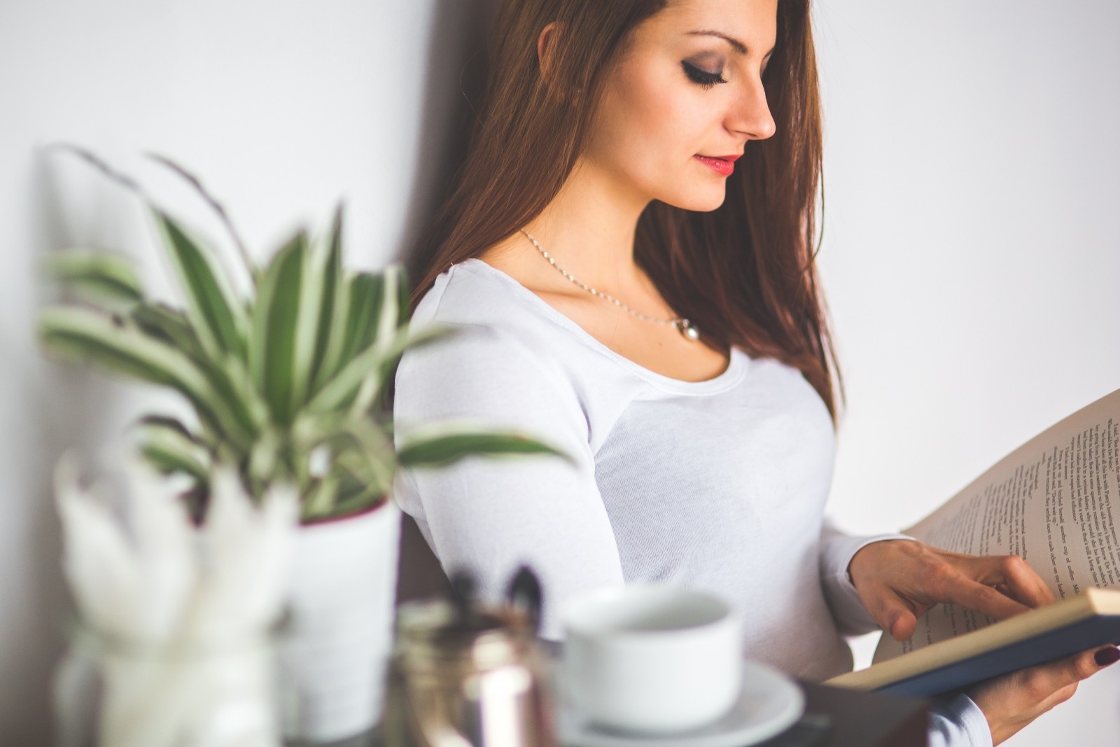 young-woman-relaxing-at-home-and-reading-a-book